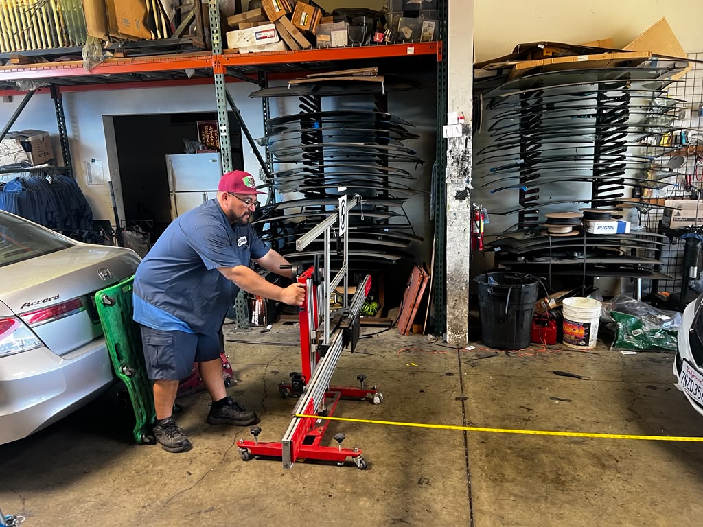 Technician operating MaxiSys ADAS calibration rig