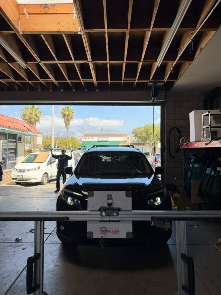Honda SUV on ADAS calibration rig at Calibration Masters Arcadia shop
